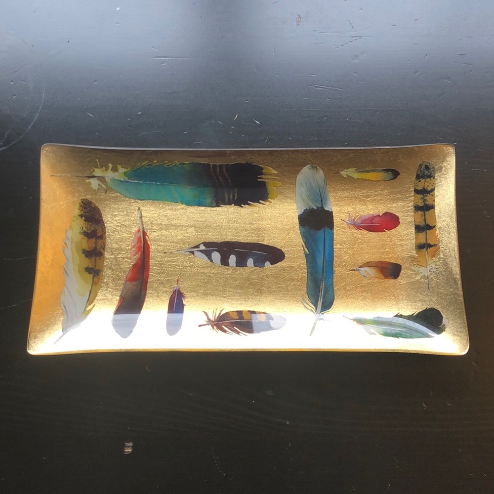 Super cute “feather” gold tray.